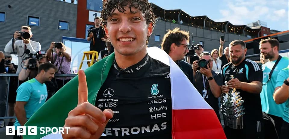 Driver celebrating with Italian flag after victory