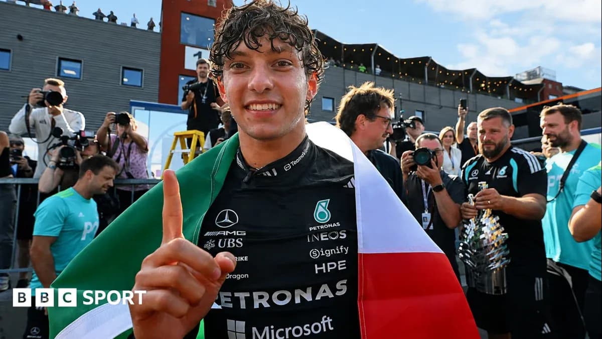 Driver celebrating with Italian flag after victory