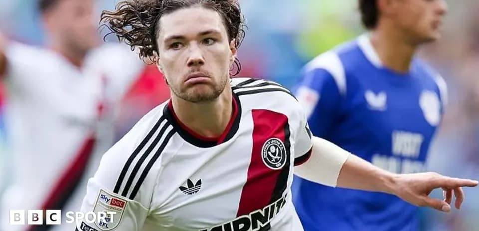 Sheffield United player celebrating a goal on field