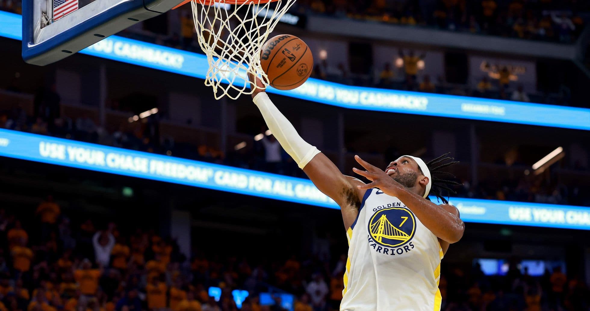 Player scoring a basket during a basketball game