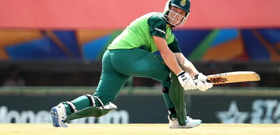 Batter playing a shot during cricket match
