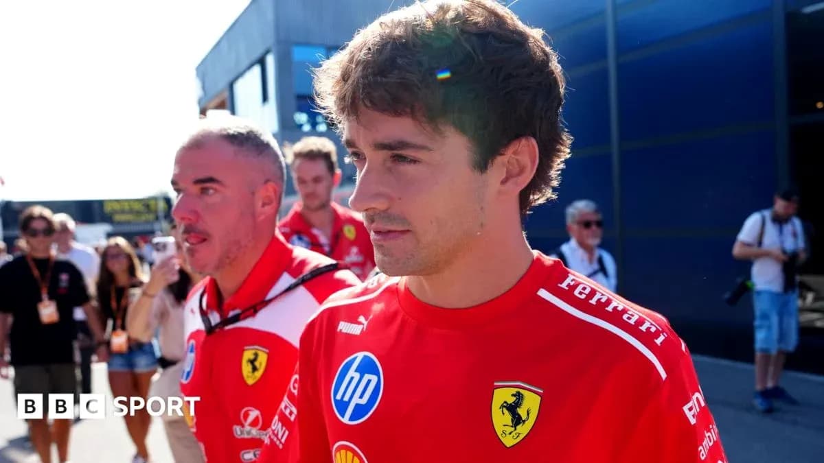 Ferrari team members walking in paddock area