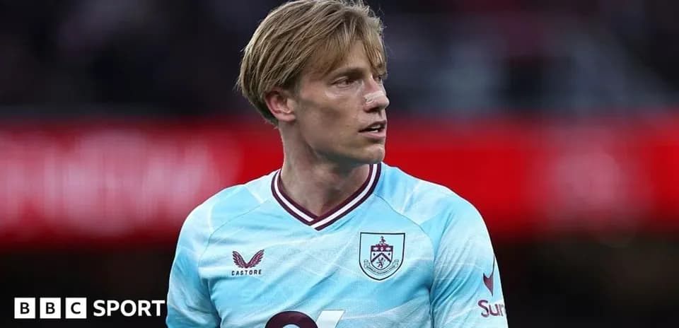 Player in Burnley kit during match action