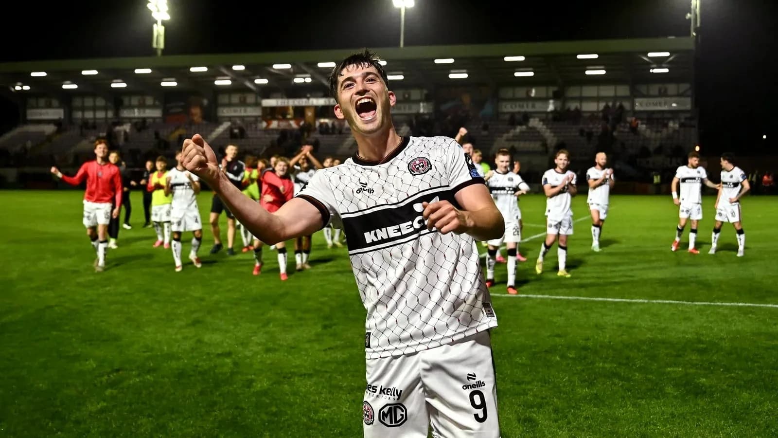Player celebrating with teammates after match victory