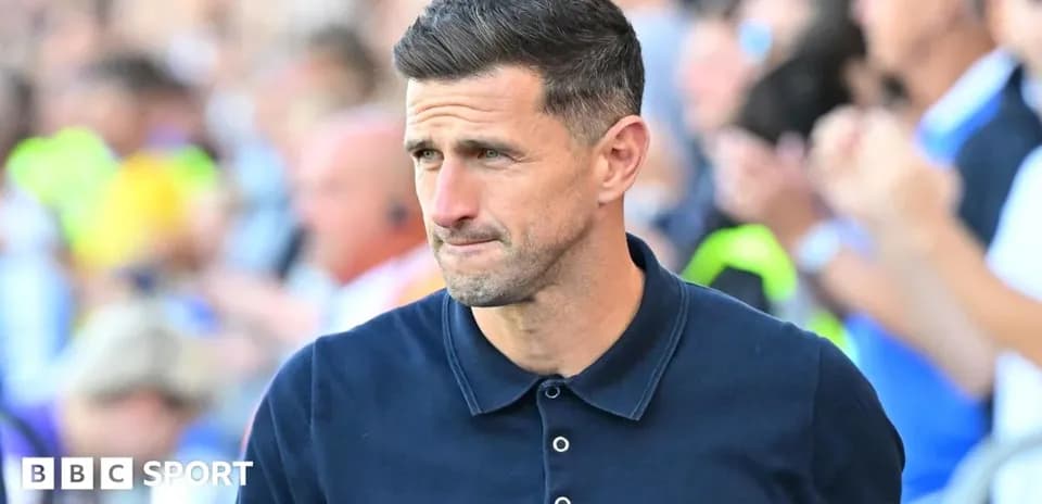 Coach walking on the sidelines during a match