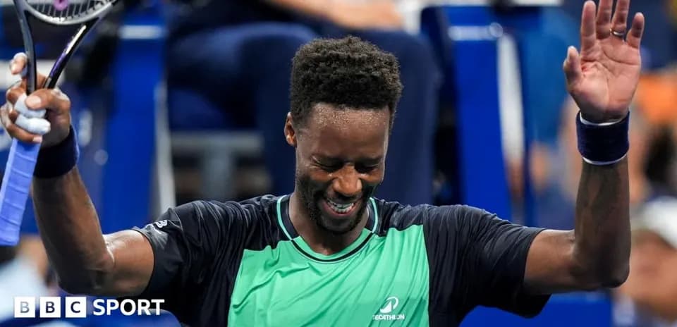 Tennis player celebrating victory with raised arms