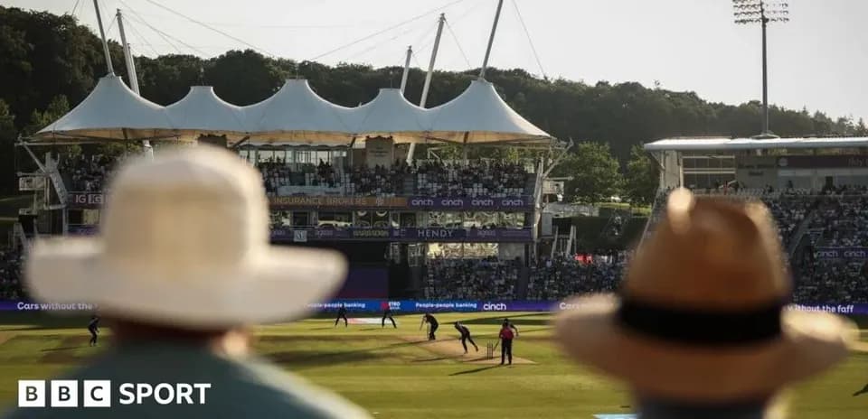Cricket match with spectators at stadium