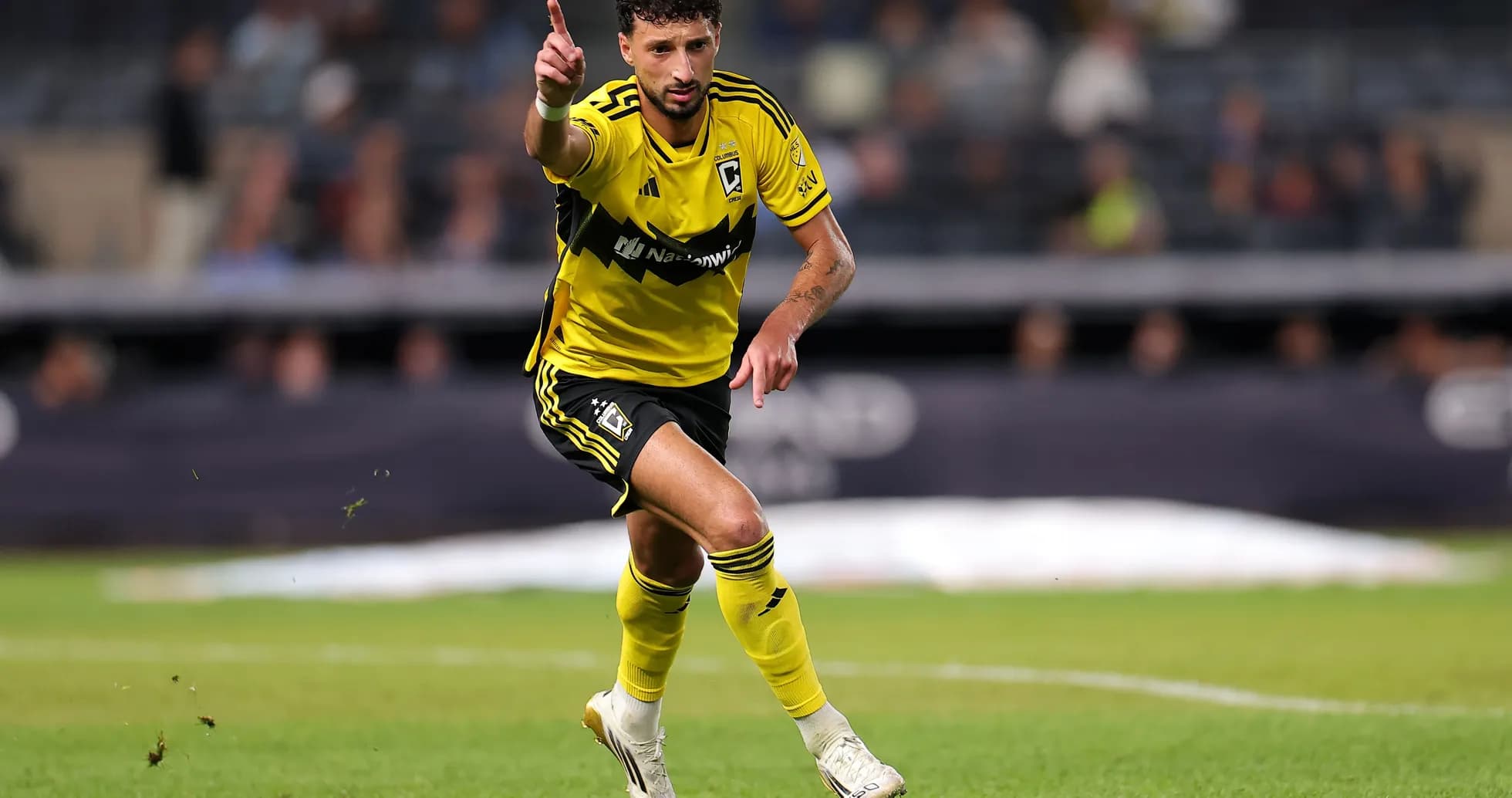Player celebrating during a soccer match on field