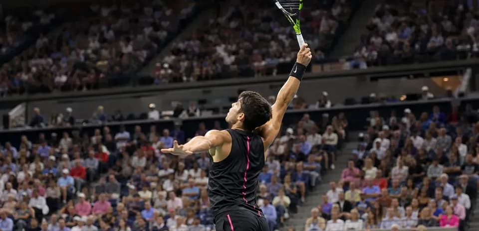 Player serving during a tennis match in stadium