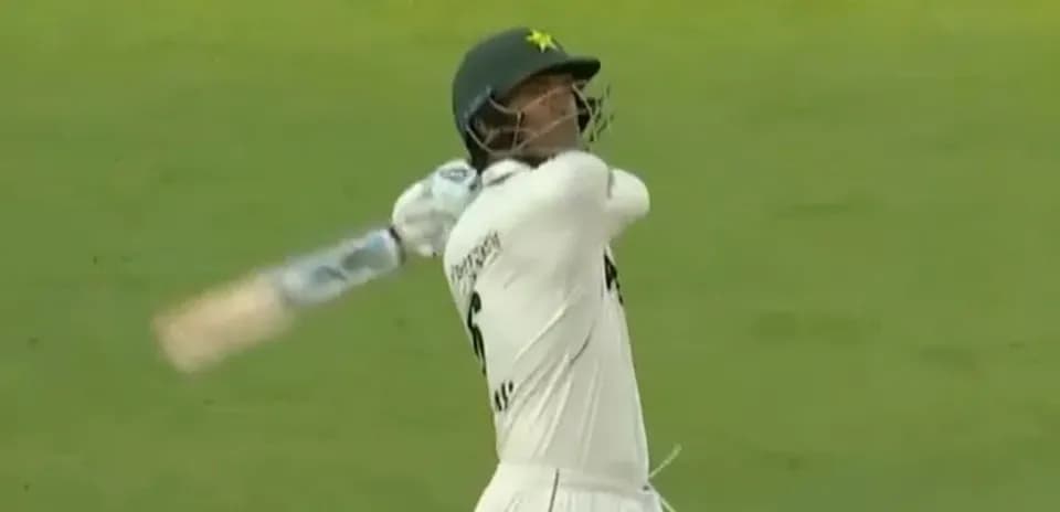 Batsman swinging bat during cricket match