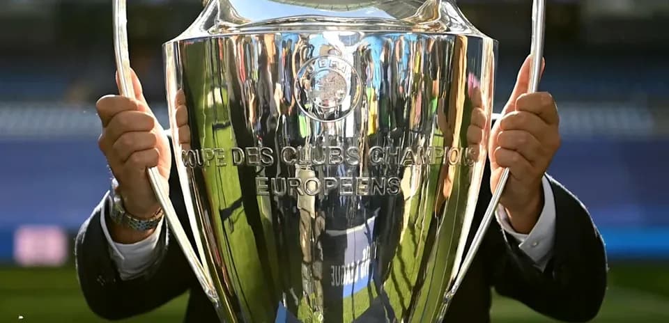 Close-up of UEFA Champions League trophy being held