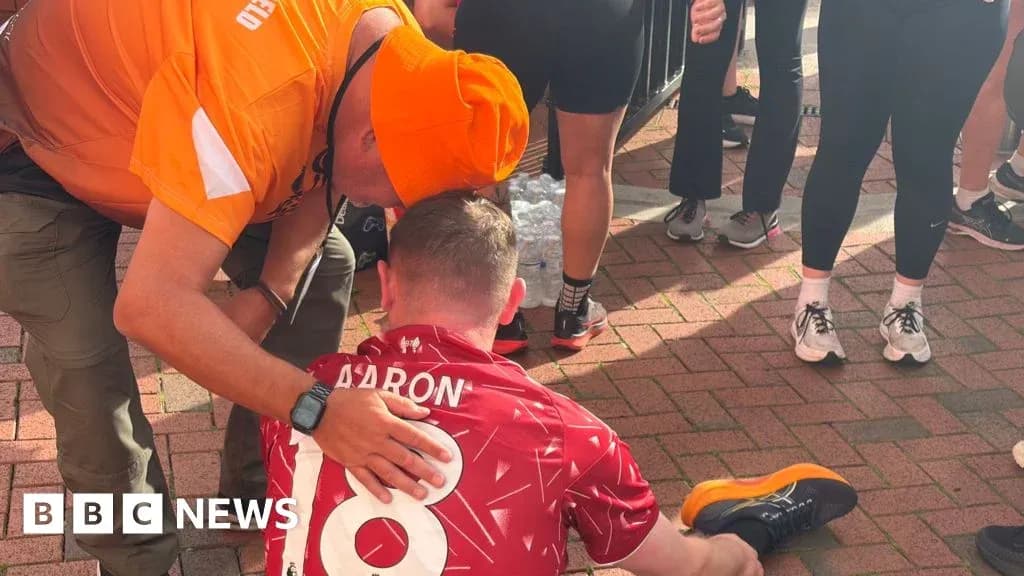 Runner receiving assistance after completing a race