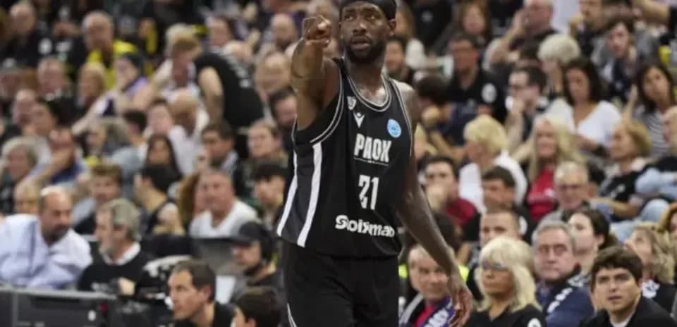 Player gesturing to the crowd during basketball game