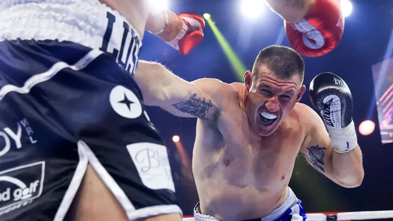 Boxer throwing a punch in the ring