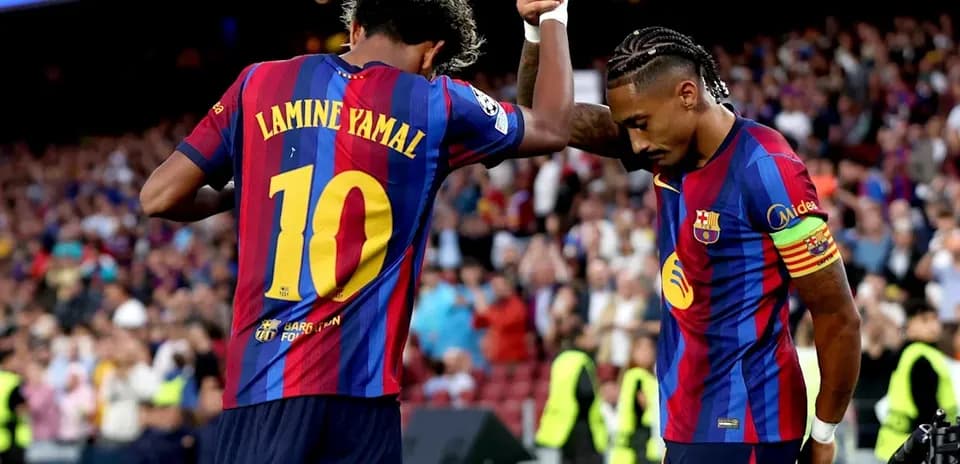 Lamine Yamal celebrating with teammate after scoring