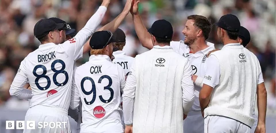 Cricket team celebrating a wicket on field