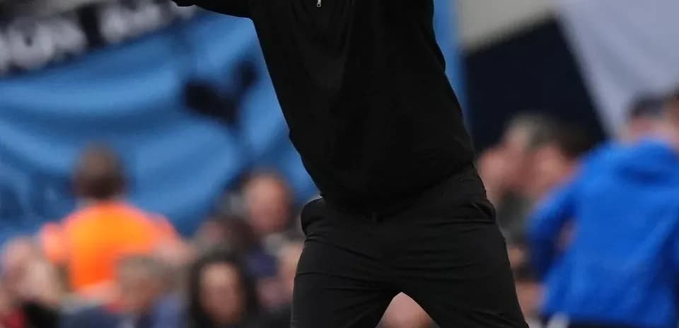 Coach directing players during a match on the sideline