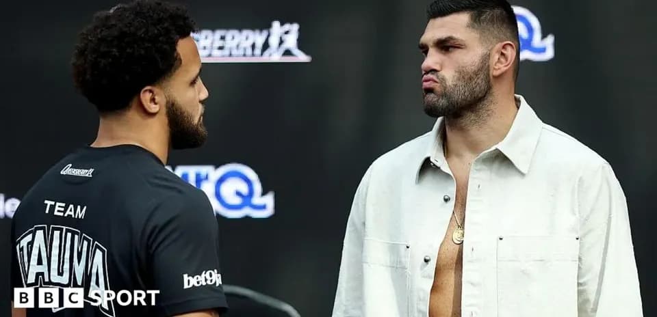Two boxers facing off at a press event