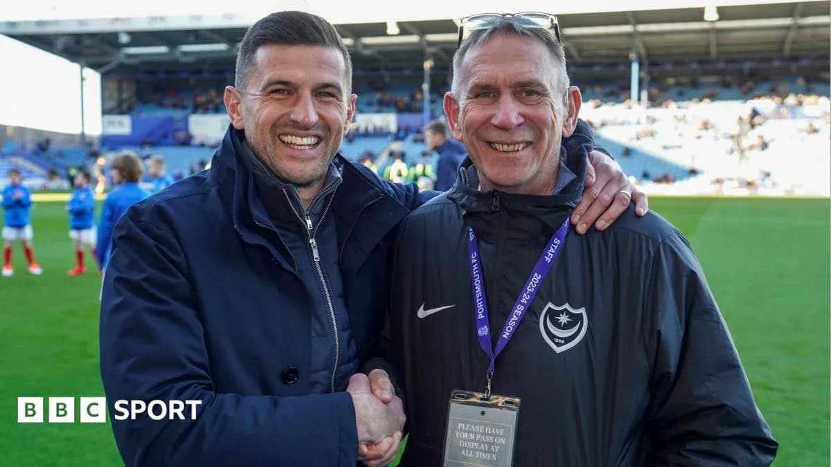 Two men shaking hands on the pitch