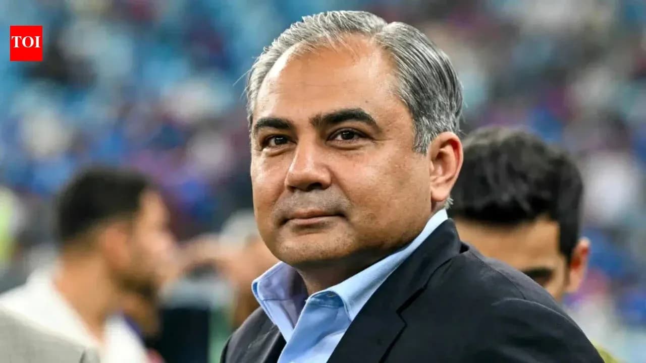 Man in suit looking towards the camera