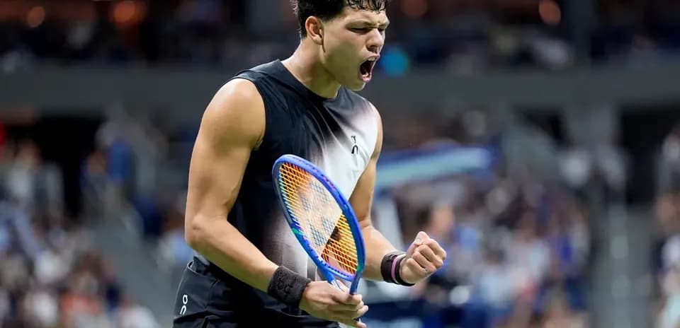 Tennis player celebrating after winning a point