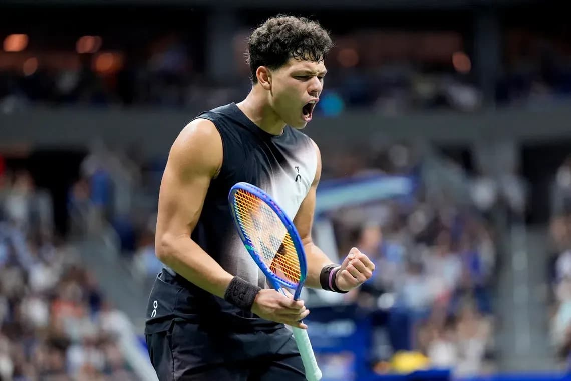 Tennis player celebrating after winning a point