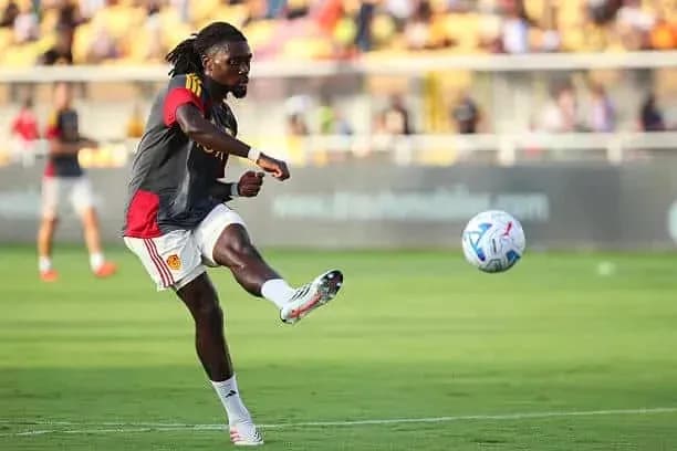 Player kicking a soccer ball during practice session