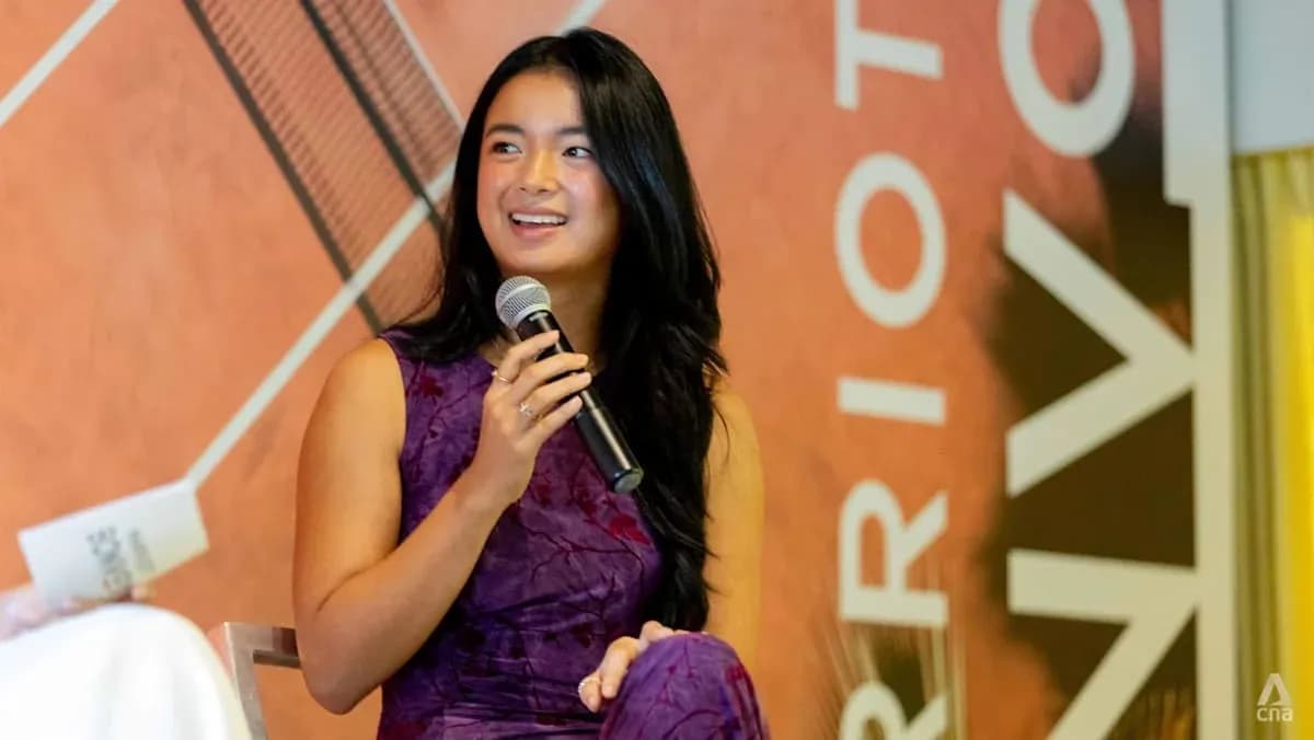 Person speaking into microphone at event