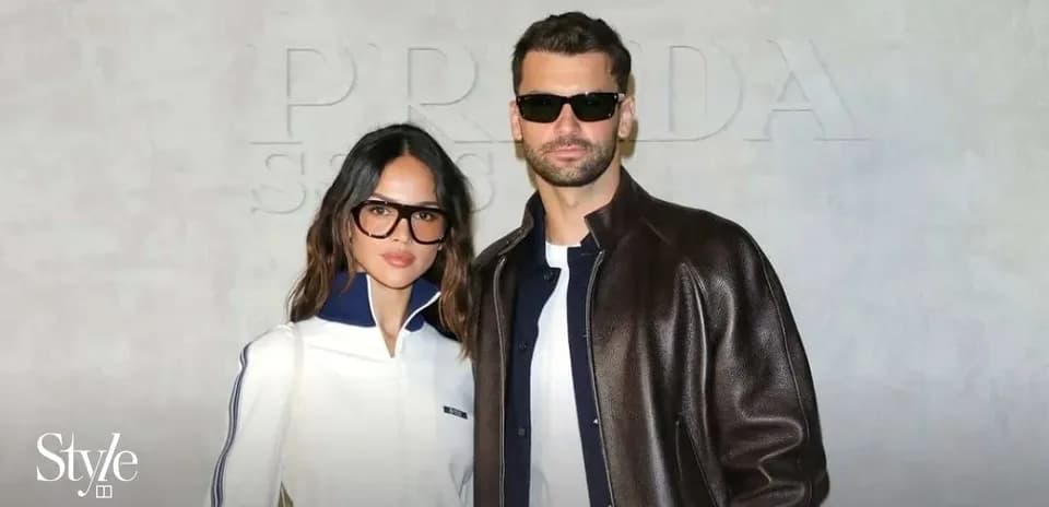 Couple posing in fashionable attire at event