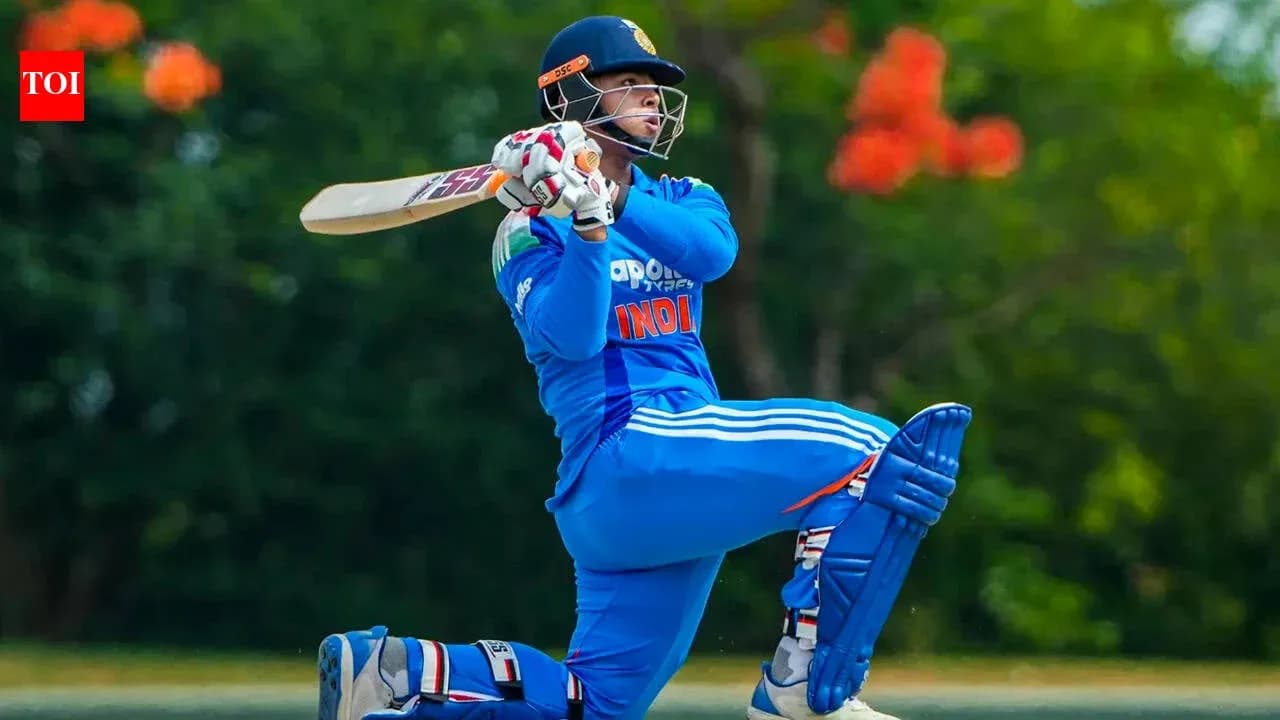 Batsman playing a shot on cricket field