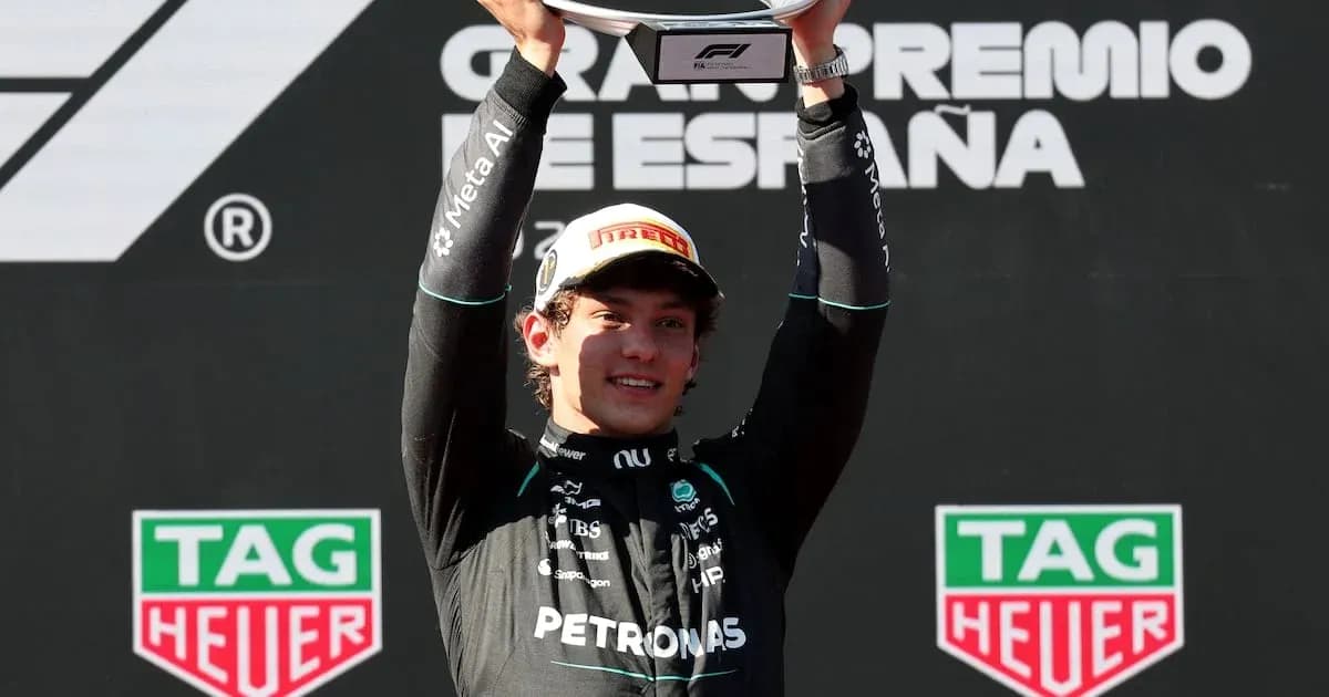 Driver celebrating victory at Formula 1 podium