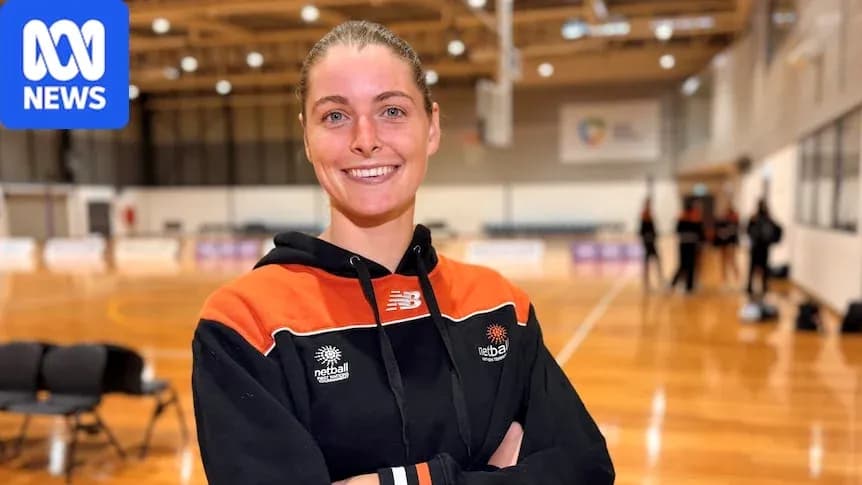 Player smiling in netball training facility
