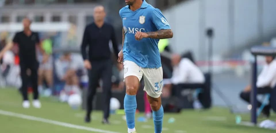 Player in blue kit running with soccer ball