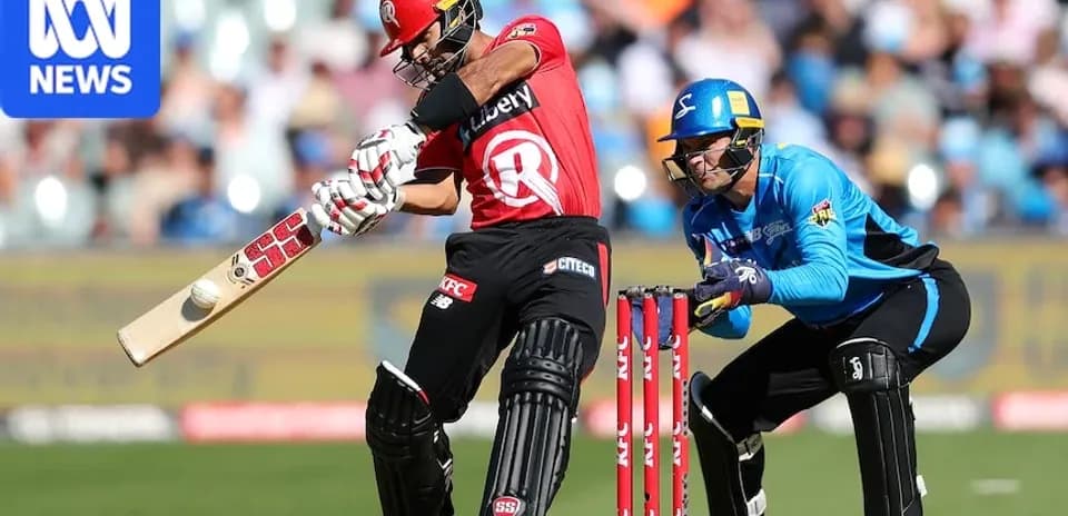 Batsman striking ball with wicketkeeper behind