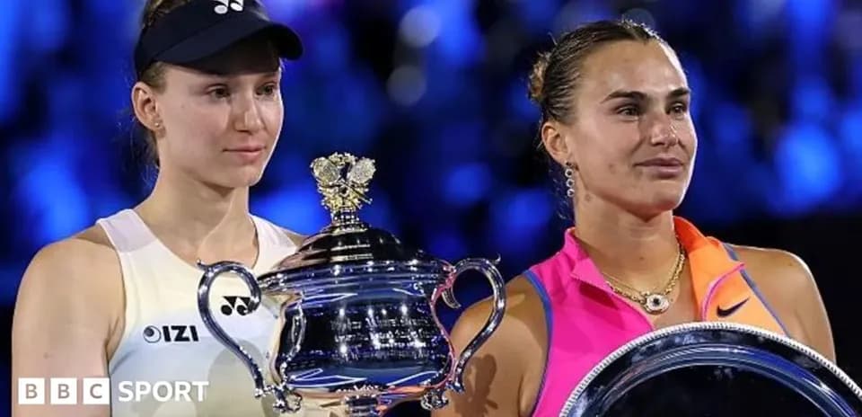 Two female tennis players holding trophies after match