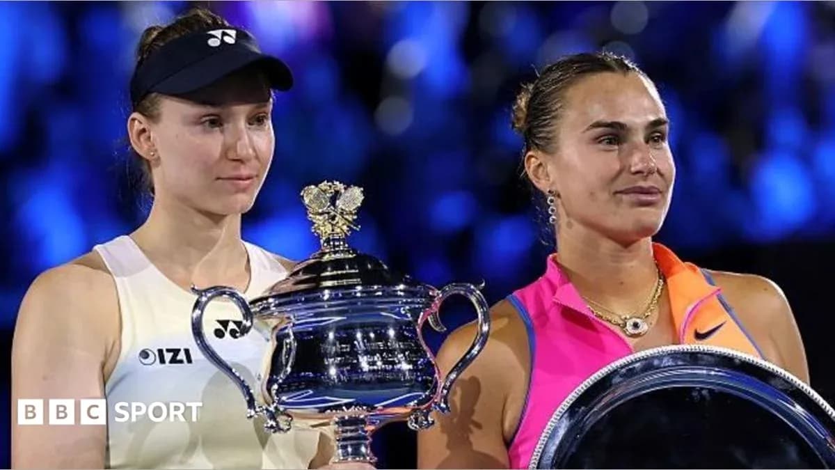 Two female tennis players holding trophies after match