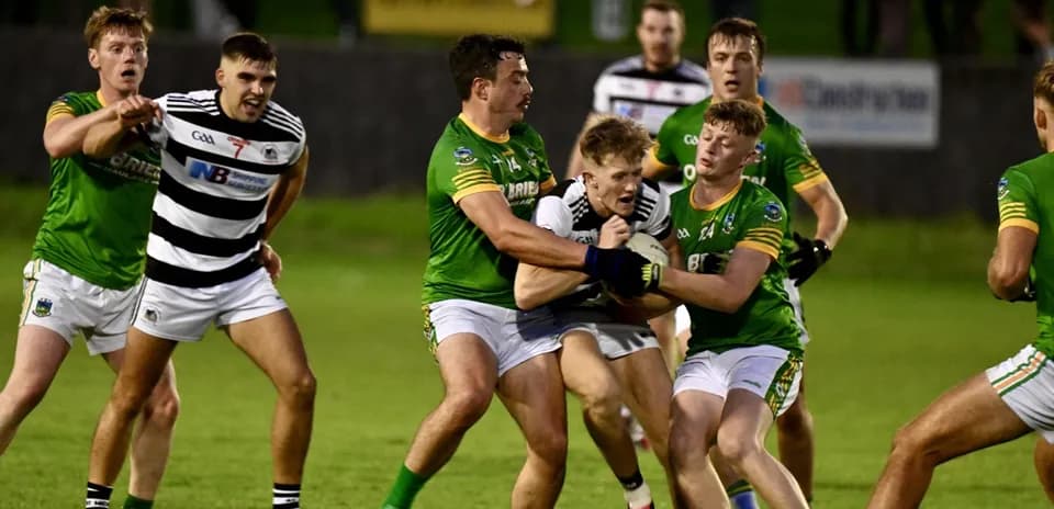 Players from both teams contesting for the ball