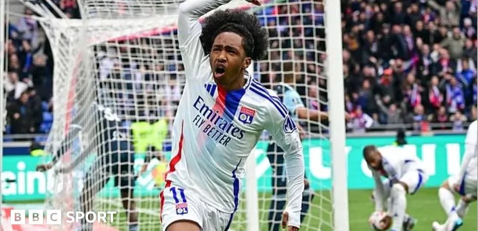 Player celebrating a goal in front of fans