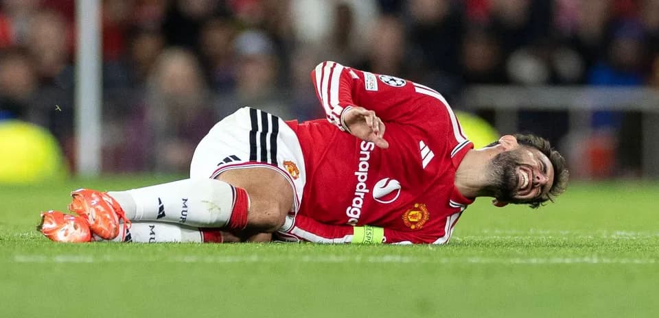 Player lying on the pitch in distress during match