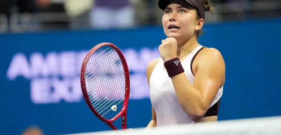 Tennis player celebrating victory during match