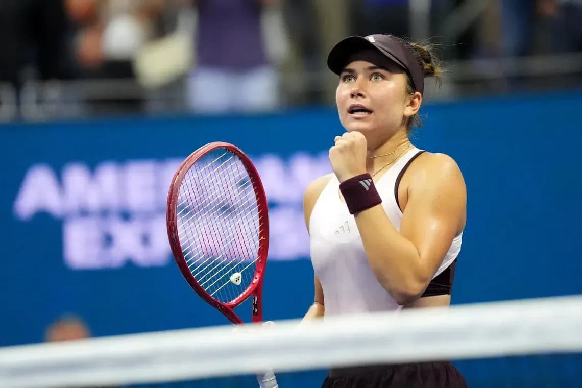 Tennis player celebrating victory during match