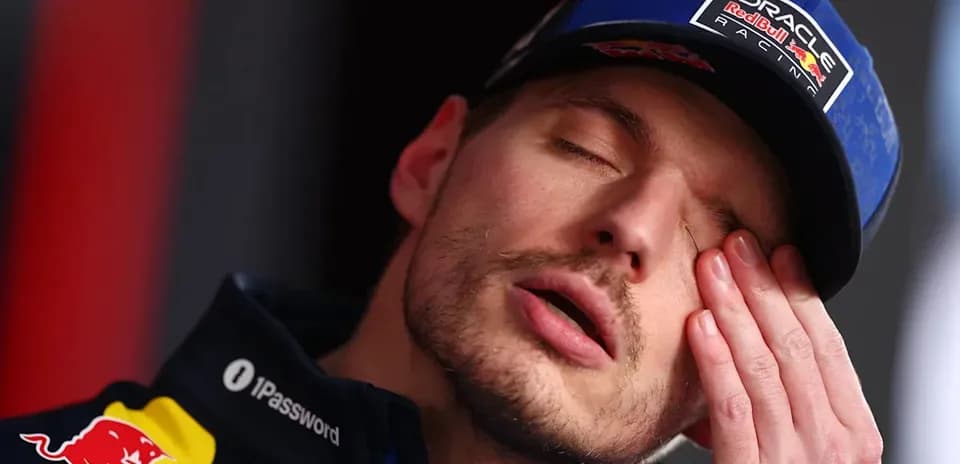 Formula 1 driver resting during press conference