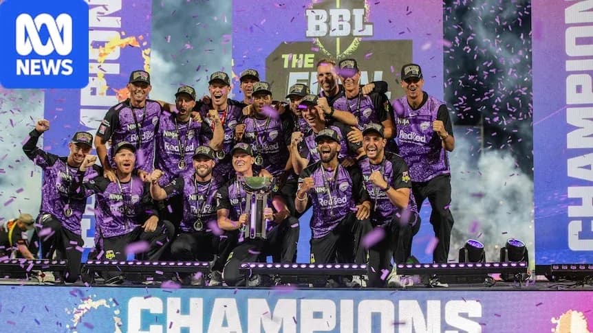 Cricket team celebrating victory with trophy on stage