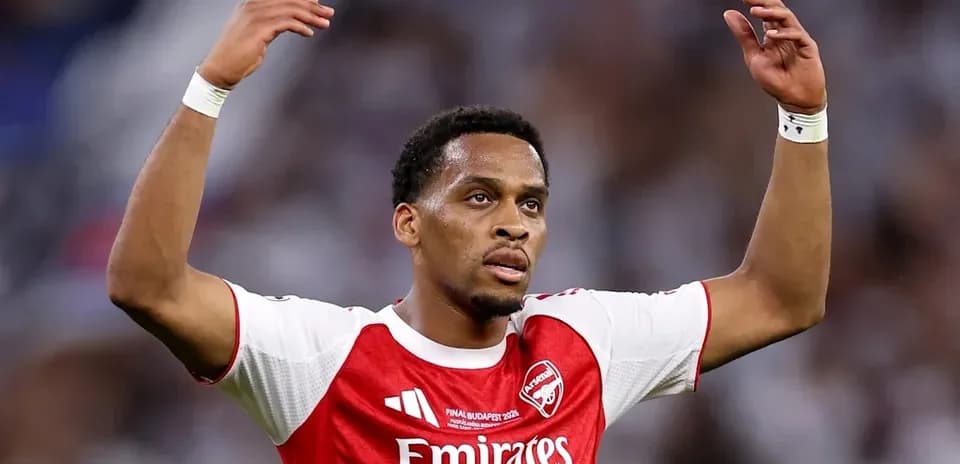 Arsenal player raising arms during match celebration