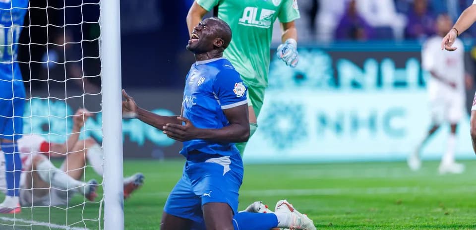 Player on knees near goal after missed opportunity
