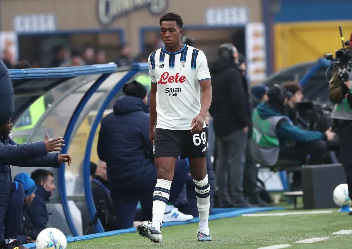 Player walking off the pitch towards the bench
