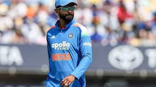 Cricketer in blue India jersey on field