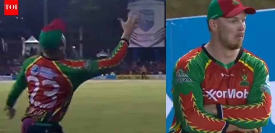 Player attempting a catch during a cricket match