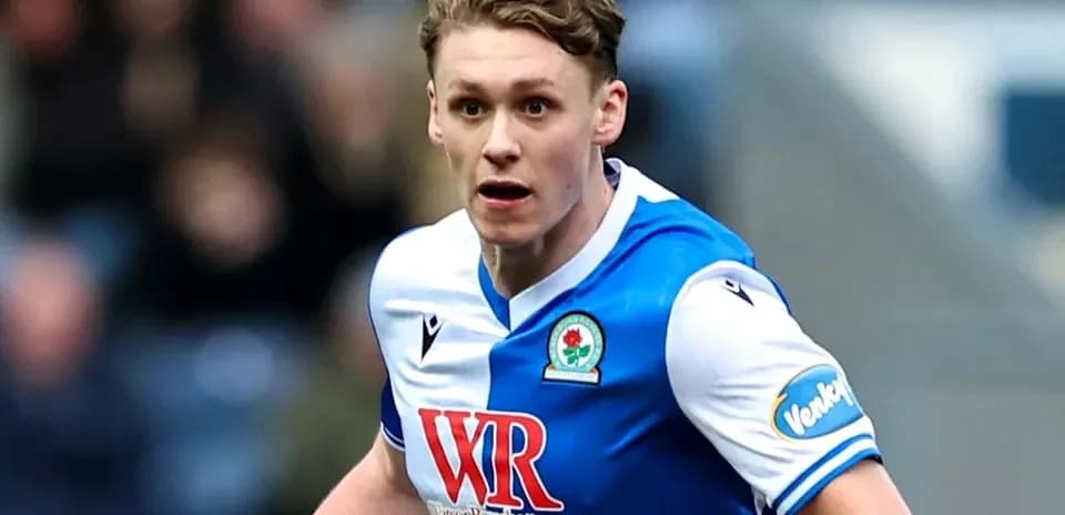 Player running during a football match for Blackburn Rovers