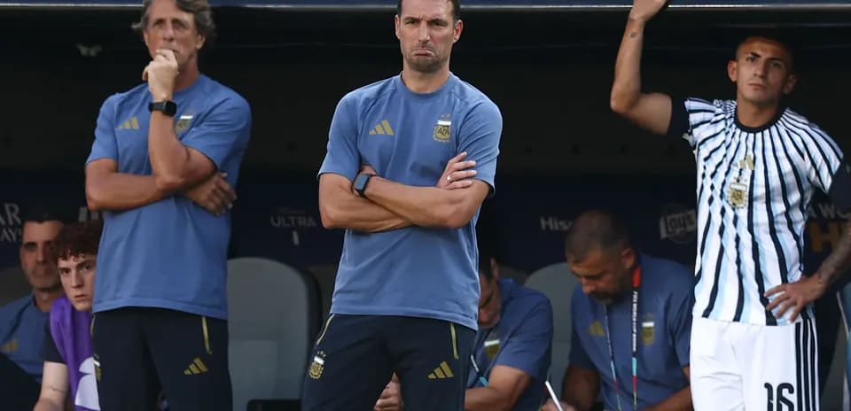 Coaches and players on the Argentina bench during match